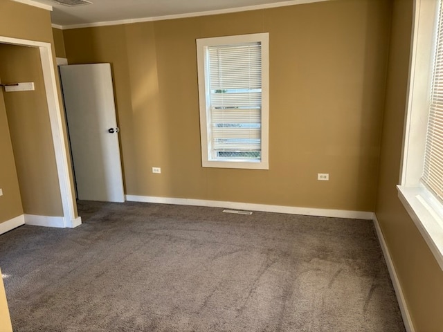 unfurnished bedroom with carpet flooring and ornamental molding