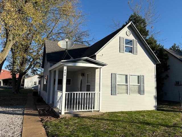 exterior space with a porch and a front lawn