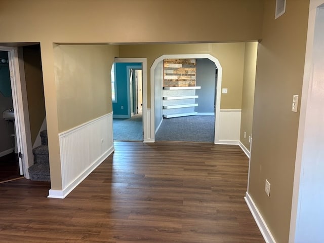 corridor with dark hardwood / wood-style floors
