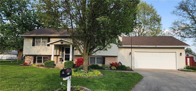 1006 N Koester Dr, Effingham, IL 62401 - view of front of property with concrete driveway, brick siding, an attached garage, and a front yard