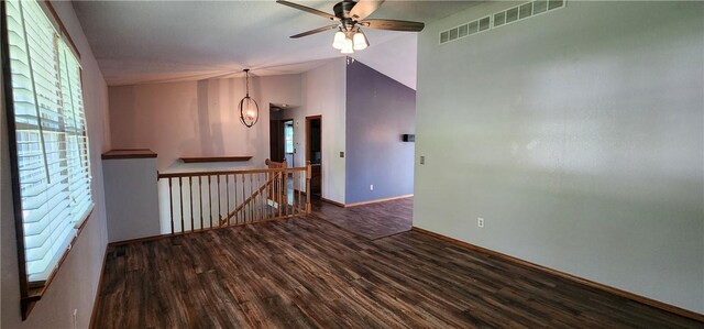 1006 N Koester Dr, Effingham, IL 62401 - spare room featuring wood finished floors, a ceiling fan, baseboards, and vaulted ceiling