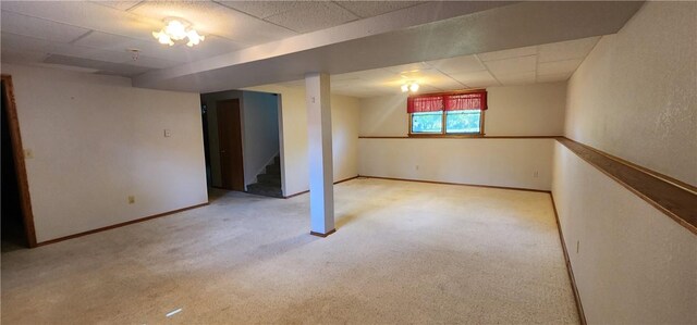 1006 N Koester Dr, Effingham, IL 62401 - below grade area featuring carpet, stairs, baseboards, and a drop ceiling