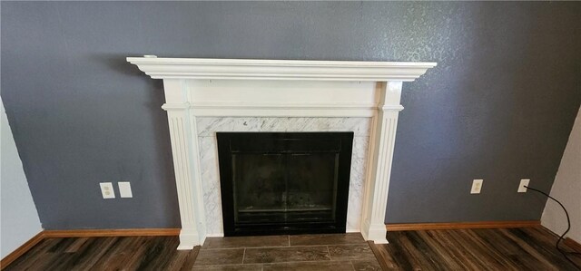 1006 N Koester Dr, Effingham, IL 62401 - detailed view of wood finished floors, baseboards, and a fireplace