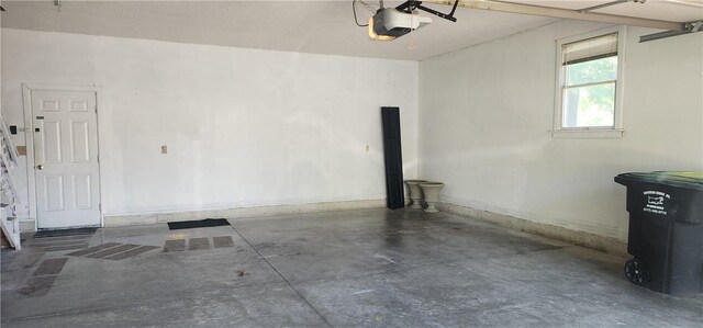 1006 N Koester Dr, Effingham, IL 62401 - garage with a garage door opener and baseboards
