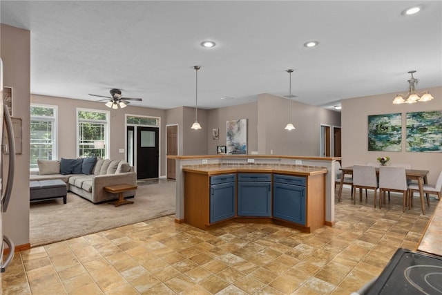 485 County Road 600 N, Neoga, IL 62447 - kitchen featuring blue cabinets, open floor plan, pendant lighting, ceiling fan, and recessed lighting