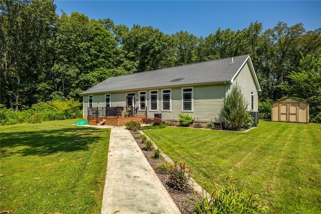 485 County Road 600 N, Neoga, IL 62447 - rear view of property featuring a storage shed and a lawn