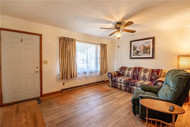 living room with light wood-type flooring, a baseboard heating unit, and ornamental molding