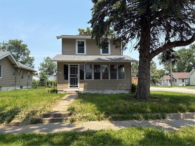2198 Hendrix St, Decatur, IL 62521 - view of front of house with roof with shingles, entry steps, and a chimney