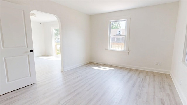 2198 Hendrix St, Decatur, IL 62521 - empty room featuring arched walkways and wood finished floors