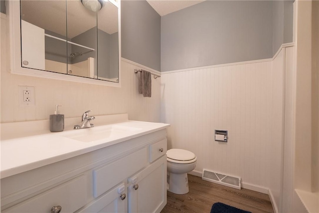 1203 Temple Ave, Effingham, IL 62401 - full bathroom featuring vanity, a shower, wood finished floors, and a wainscoted wall