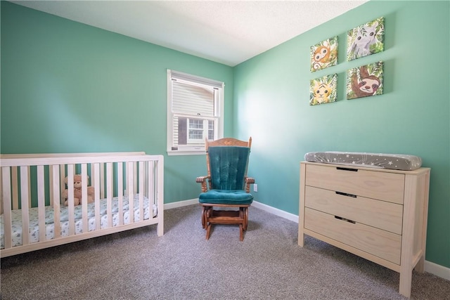 1203 Temple Ave, Effingham, IL 62401 - carpeted bedroom with baseboards and a nursery area