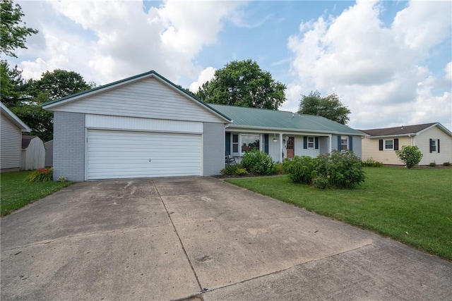 1203 Temple Ave, Effingham, IL 62401 - ranch-style house featuring brick siding, an attached garage, concrete driveway, and a front lawn
