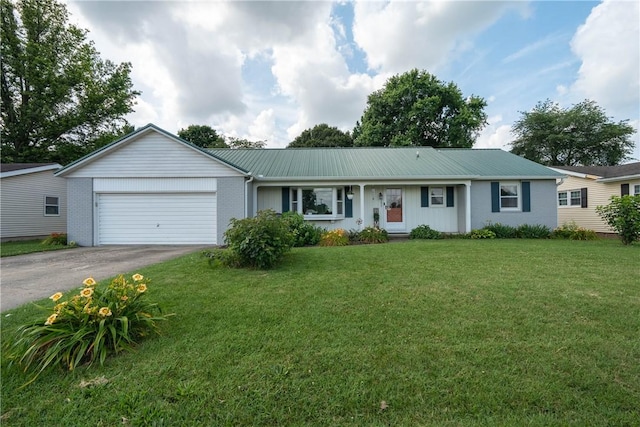 1203 Temple Ave, Effingham, IL 62401 - ranch-style house featuring asphalt driveway, an attached garage, a front lawn, and a metal roof