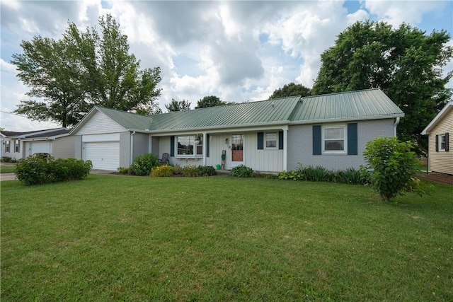 1203 Temple Ave, Effingham, IL 62401 - ranch-style home with an attached garage, a front lawn, a metal roof, and brick siding