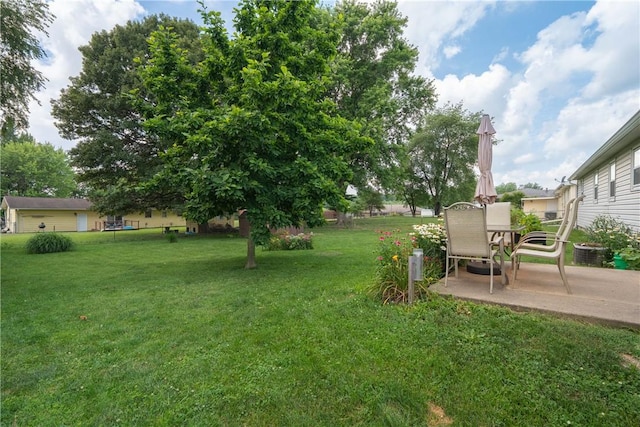 1203 Temple Ave, Effingham, IL 62401 - view of grassy yard featuring a patio