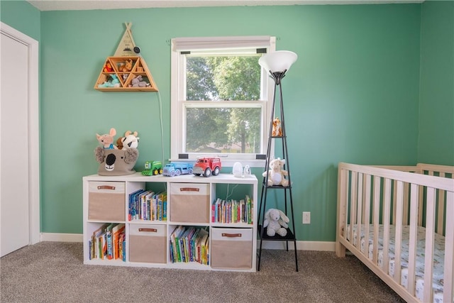 1203 Temple Ave, Effingham, IL 62401 - carpeted bedroom featuring a crib and baseboards