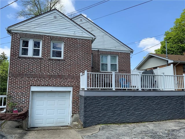 1905 N Vermilion St, Danville, IL 61832 - view of front facade featuring brick siding and an attached garage