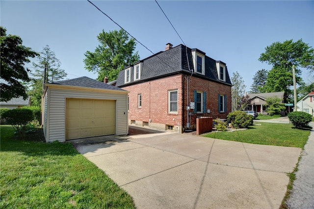 164 S Linden Ave, Decatur, IL 62522 - view of property exterior featuring a shingled roof, driveway, brick siding, mansard roof, and an outbuilding