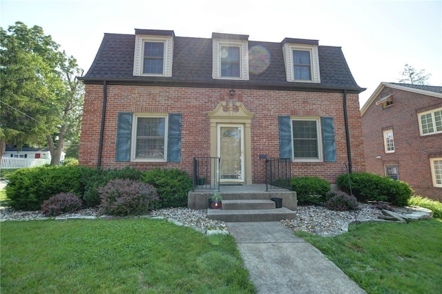 164 S Linden Ave, Decatur, IL 62522 - view of front of home featuring mansard roof, brick siding, and a shingled roof