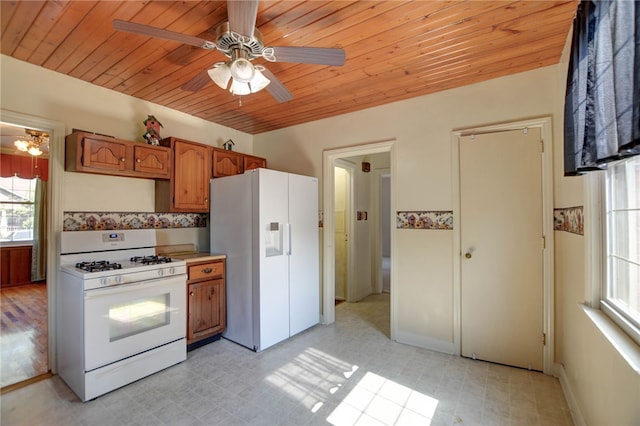 164 S Linden Ave, Decatur, IL 62522 - kitchen featuring white appliances, brown cabinets, wooden ceiling, light flooring, and a ceiling fan