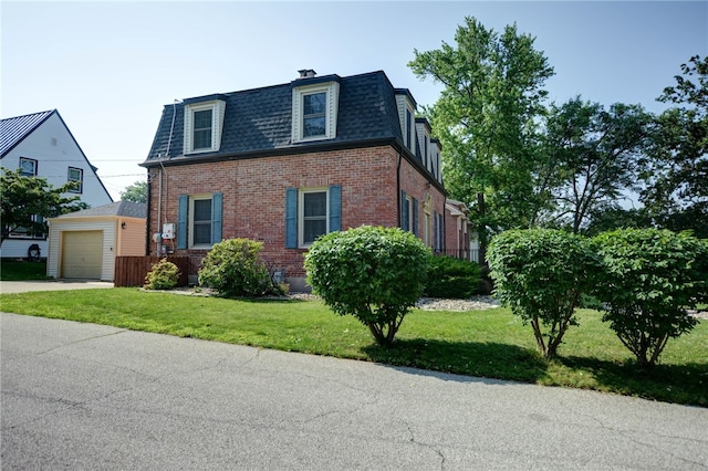 164 S Linden Ave, Decatur, IL 62522 - view of front of house featuring mansard roof, brick siding, roof with shingles, and a front yard