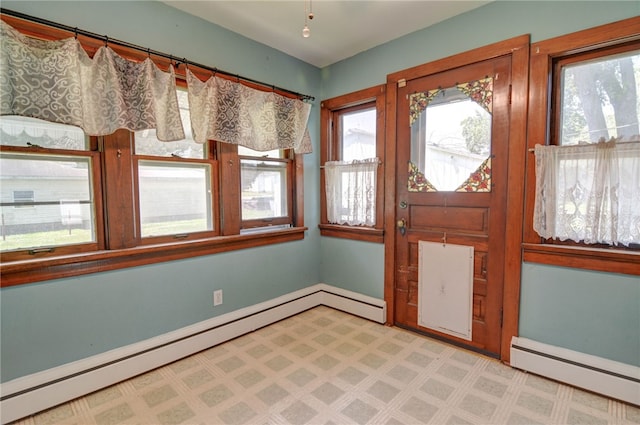 319 N Macon St, Moweaqua, IL 62550 - foyer featuring baseboard heating and light flooring