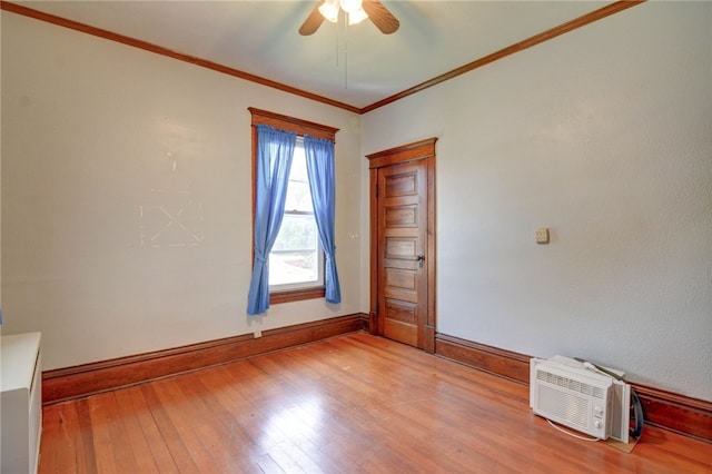 319 N Macon St, Moweaqua, IL 62550 - unfurnished room featuring ceiling fan, light wood-style floors, and crown molding