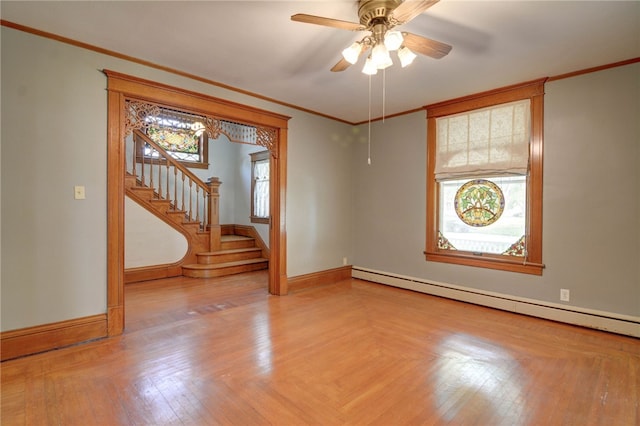 319 N Macon St, Moweaqua, IL 62550 - unfurnished room with baseboard heating, stairs, crown molding, and ceiling fan