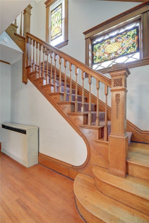 319 N Macon St, Moweaqua, IL 62550 - stairway featuring wood finished floors and baseboards