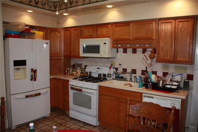 235 E 150 N Rd, Hammond, IL 61929 - kitchen featuring white appliances, brown cabinets, light countertops, tasteful backsplash, and light tile patterned floors