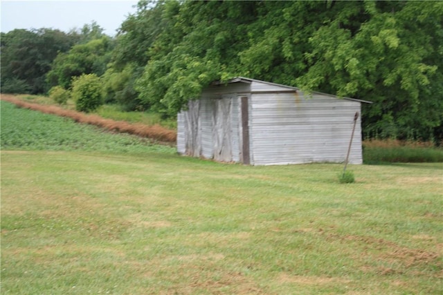 235 E 150 N Rd, Hammond, IL 61929 - view of outdoor structure featuring a wooded view