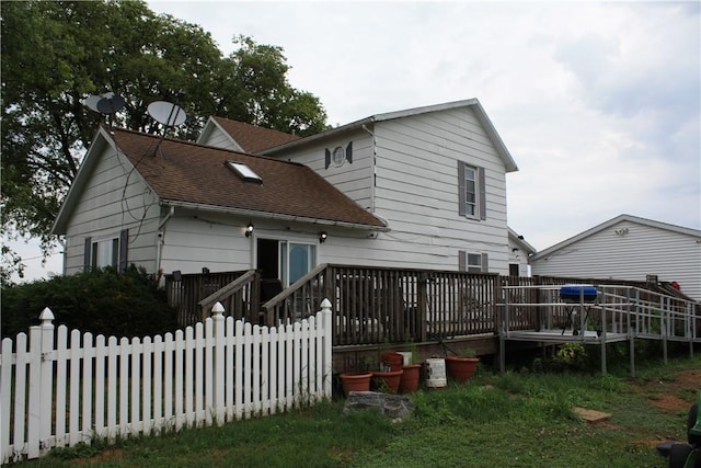 235 E 150 N Rd, Hammond, IL 61929 - back of property featuring a deck and a shingled roof