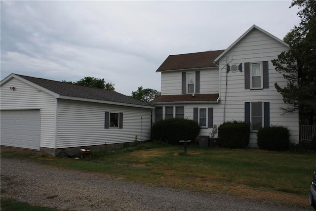 235 E 150 N Rd, Hammond, IL 61929 - traditional-style home featuring driveway, an outbuilding, and a shingled roof