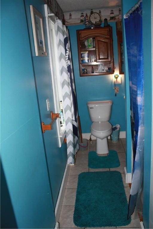 235 E 150 N Rd, Hammond, IL 61929 - full bath with tile patterned floors and a shower with shower curtain