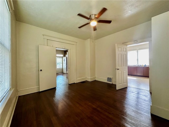 996 W Packard St, Decatur, IL 62522 - unfurnished room with a ceiling fan and dark wood-type flooring
