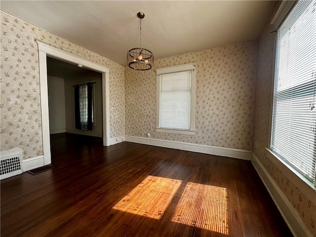 996 W Packard St, Decatur, IL 62522 - unfurnished dining area with hardwood / wood-style flooring, a chandelier, and wallpapered walls