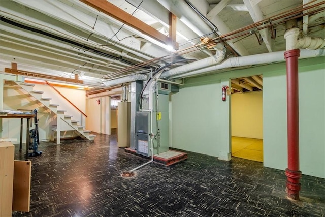2417 Maple Ave, Decatur, IL 62526 - basement with water heater, heating unit, and stairs