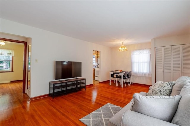 2417 Maple Ave, Decatur, IL 62526 - living room featuring a chandelier and wood finished floors