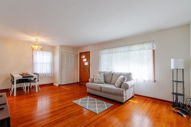 2417 Maple Ave, Decatur, IL 62526 - living room with plenty of natural light, a chandelier, and wood finished floors