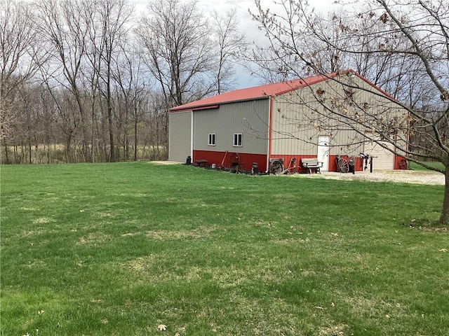 view of pole building with a yard