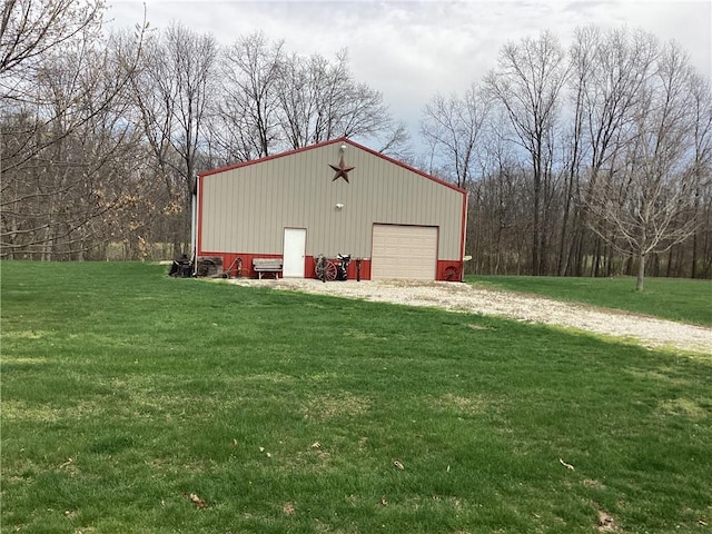 view of outbuilding featuring driveway and an outdoor structure