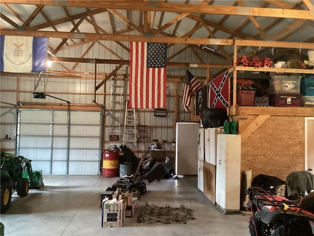 garage featuring metal wall and a garage door opener