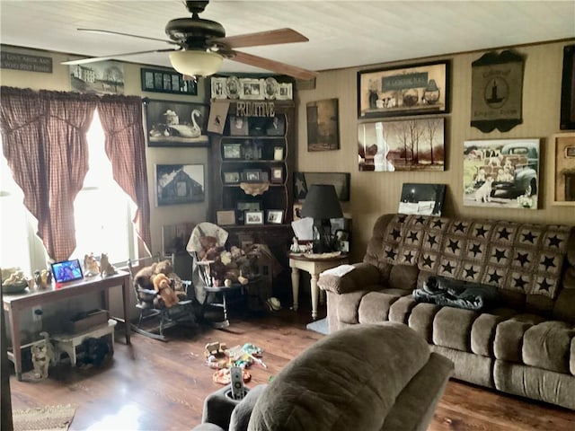 living room featuring wood finished floors and ceiling fan