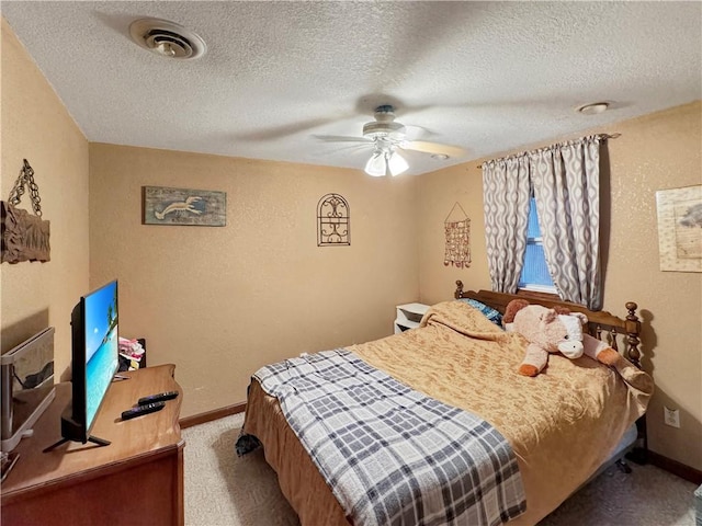 bedroom with baseboards, visible vents, a textured wall, ceiling fan, and carpet flooring