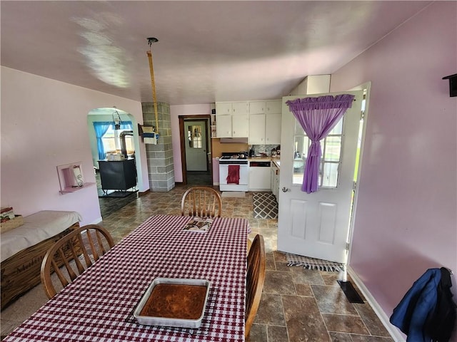 17204 N 125th St, Oblong, IL 62449 - dining area featuring stone tile floors, healthy amount of natural light, and arched walkways
