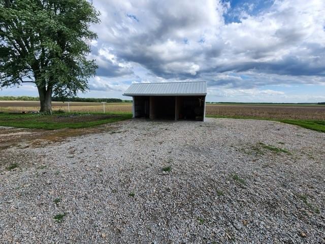 17204 N 125th St, Oblong, IL 62449 - view of pole building featuring gravel driveway, a carport, and a view of rural / pastoral area