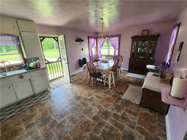 17204 N 125th St, Oblong, IL 62449 - dining space featuring stone tile floors and baseboards