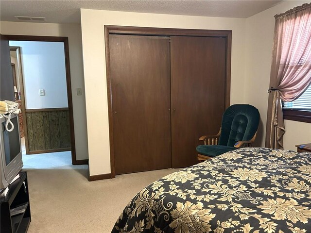 601 Holiday Dr, Effingham, IL 62401 - bedroom with a closet, light colored carpet, and multiple windows