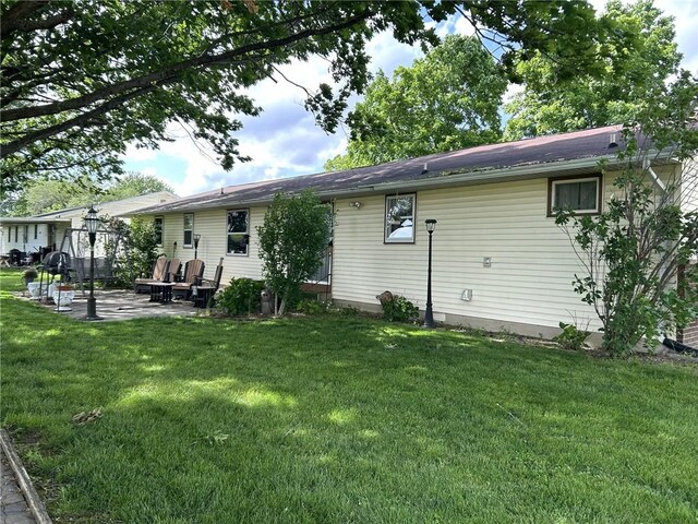 601 Holiday Dr, Effingham, IL 62401 - rear view of property with a patio and a yard