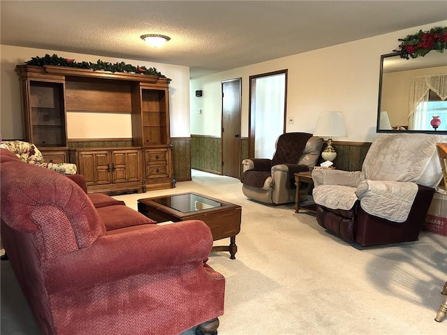 601 Holiday Dr, Effingham, IL 62401 - living area with a wainscoted wall, carpet floors, wooden walls, and a textured ceiling
